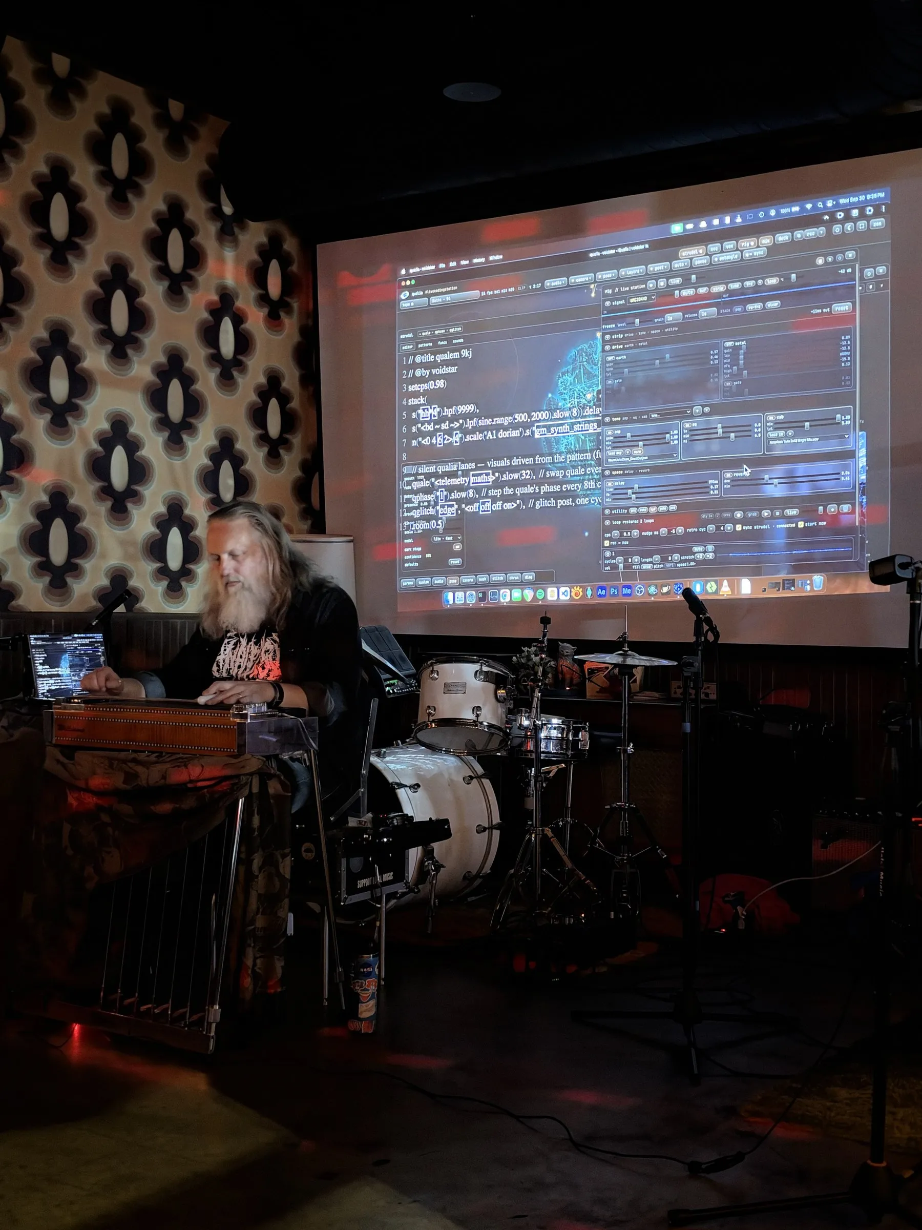 Randy Brown at the pedal steel with a laptop while the qualia instrument and live code are projected on a screen behind